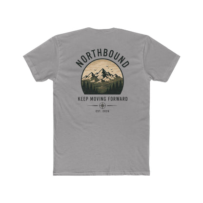 A gray short-sleeve t-shirt shown from the back, featuring a circular graphic print of a mountain range with the text 'NORTHBOUND' and 'KEEP MOVING FORWARD EST. 2026'.